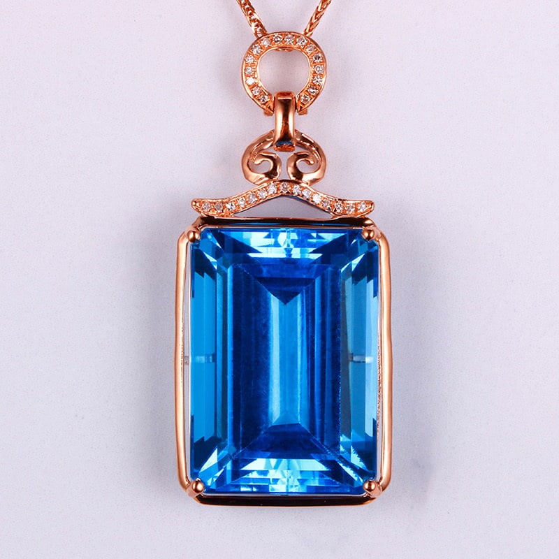 14k Gold 32.35 Ctw Natural Topaz & Diamond Pendant( Without Chain ): Ref:231032164 // gold content:14k gold // main gemstone:topaz // shape:octagonal // carat weight:32. 26ct // color:blue // treatment:natural // // adjacent gemstone 2 : diamond // shape:round //