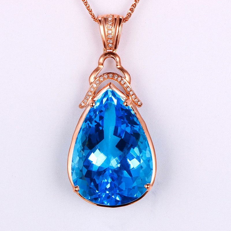14k Gold 23.06 Ctw Natural Topaz & Diamond Pendant( Without Chain ): Ref:231032166 // gold content:14k gold // main gemstone:topaz // shape:pear // carat weight:22. 98ct // color:blue // treatment:natural // // adjacent gemstone 2 : diamond // shape:round // carat