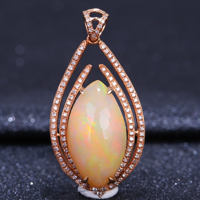 14k Gold 7.07 Ct Natural Opal & Diamond Pendant( Without Chain ): Ref:231032192 // gold content:14k gold // main gemstone:opal // shape:marquise // carat weight:7. 07ct // color:color // treatment:natural // // adjacent gemstone 2 : diamond // shape:round //