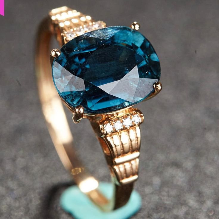 14k Gold 2.55 Ct Natural Tourmaline & Diamond Ring: Ref:231032212 // gold content:14k gold // ring size:7. 25us // // main gemstone:tourmaline // shape:oval // carat weight:2. 55ct // color:blue // treatment:natural // // adjacent gemstone 2 : diamond