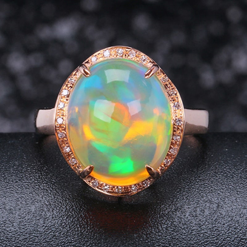 14k Gold 6.67 Ctw Natural Opal & Diamond Ring: Ref:231032264 // gold content:14k gold // ring size:7. 25us // // main gemstone:opal // shape:oval // carat weight:6. 60ct // color:color // treatment:natural // // adjacent gemstone 2 : diamond //