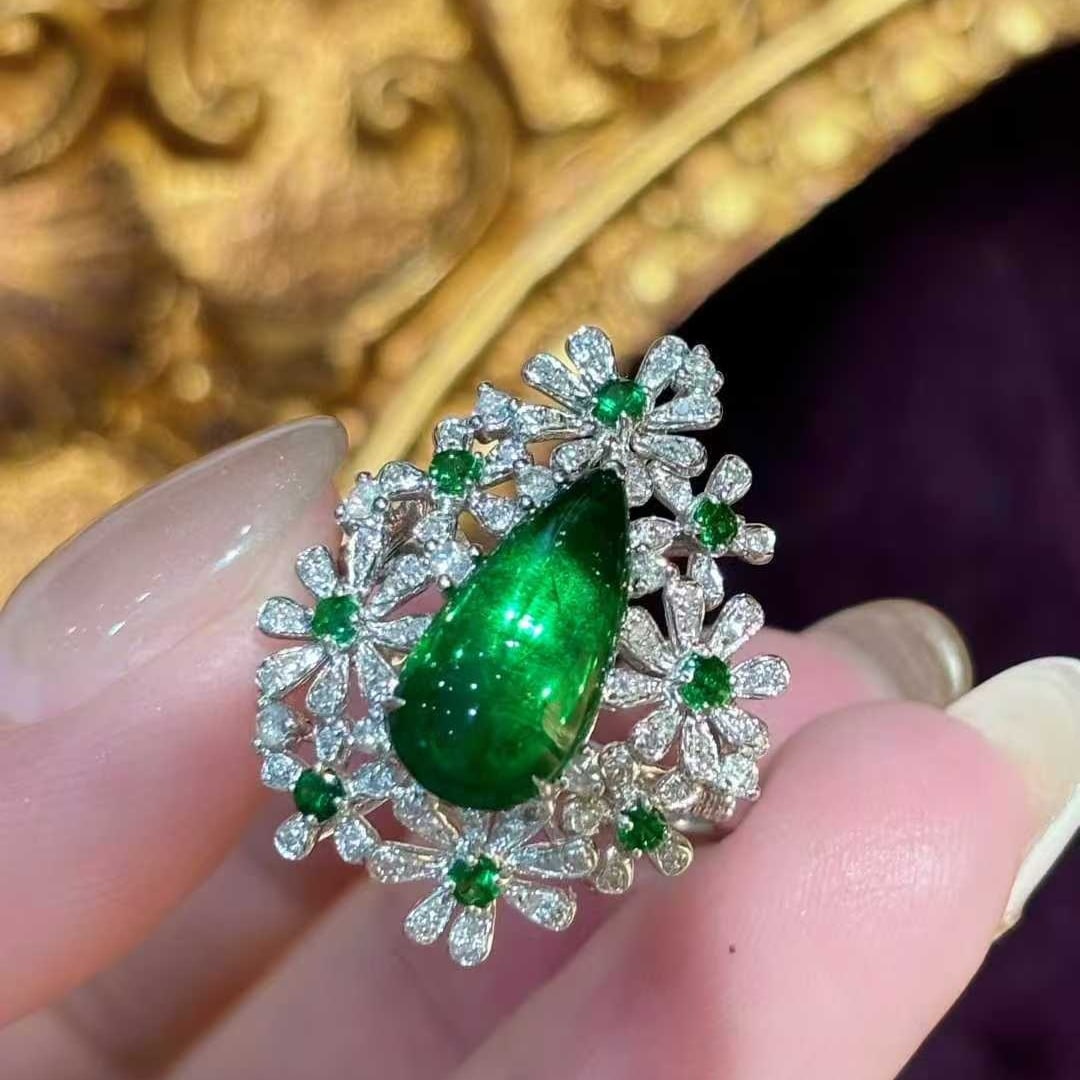 14k Gold 2.55 Ct Vivid Green Natural Tsavorite & Diamond Ring: Ref:231032268 // gold content:14k gold // ring size:7. 25us // // main gemstone:tsavorite // shape:pear // carat weight:2. 55ct // color:vivid green // treatment:natural // // adjacent gemstone 2 :