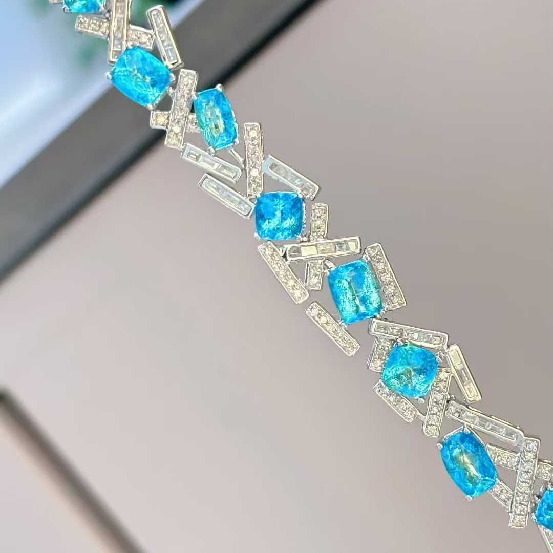 14k Gold 5.03 Ct Natural Paraiba Tourmaline & Diamond Bracelet: Ref:231032273 // gold content:14k gold // main gemstone:paraiba tourmaline // shape:cushion // carat weight:5. 03ct // color:blue // treatment:natural // // adjacent gemstone 2 : diamond //
