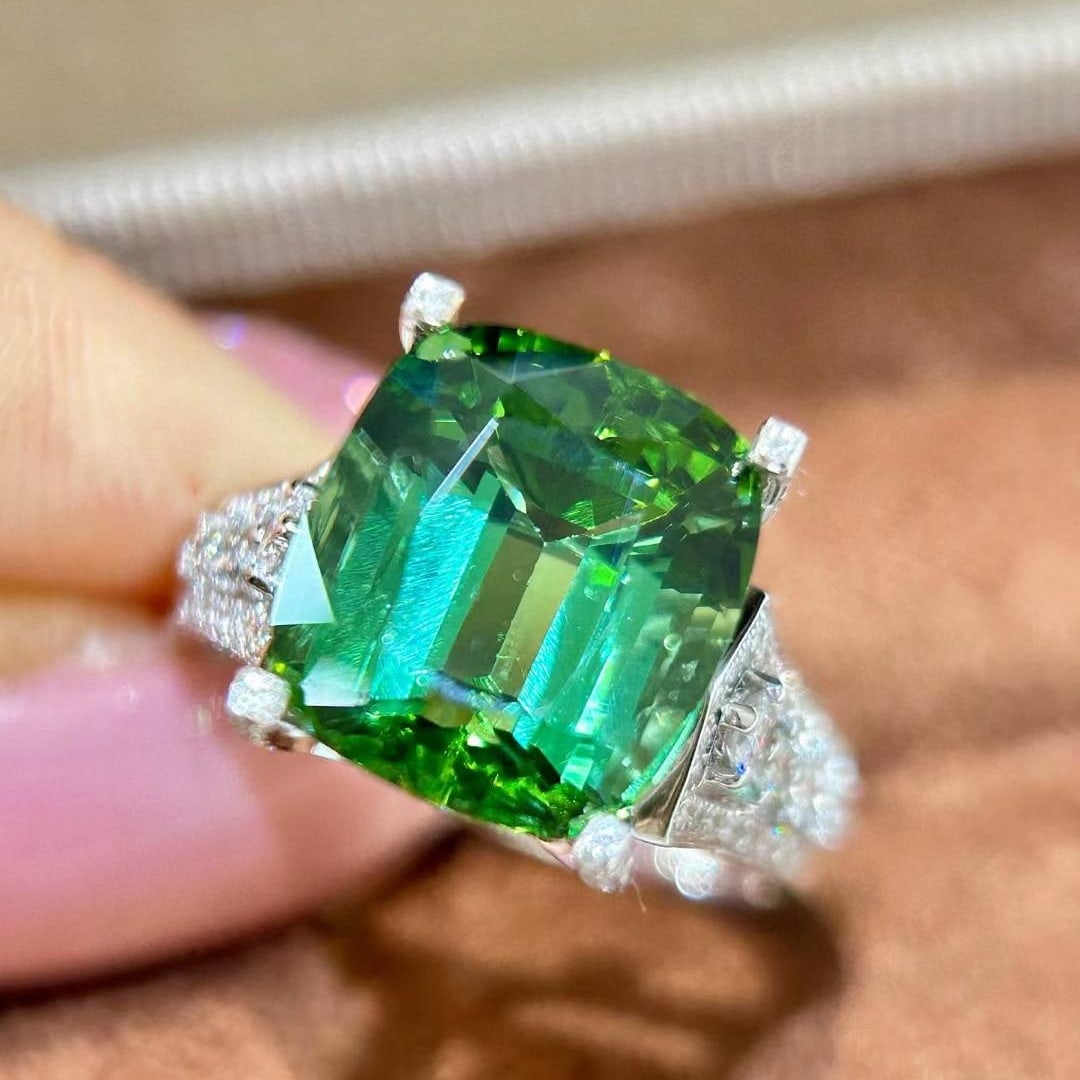 14k Gold 7.94 Ctw Natural Tourmaline & Diamond Ring: Ref:231032309 // gold content:14k gold // ring size:7. 25us // // main gemstone:tourmaline // shape:cushion // carat weight:7. 37ct // color:green // treatment:natural // // adjacent gemstone 2 : diam