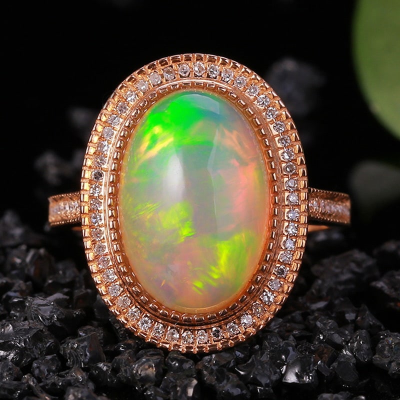 14k Gold 5.38 Ctw Natural Opal & Diamond Ring: Ref:231032352 // gold content:14k gold // ring size:7. 25us // // main gemstone:opal // shape:oval // carat weight:5. 18ct // color:color // treatment:natural // // adjacent gemstone 2 : diamond //