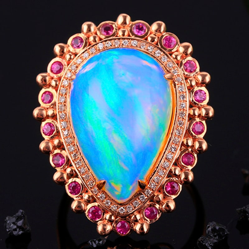 14k Gold 9.28 Ct Natural Opal & Diamond & Ruby Ring: Ref:231032353 // gold content:14k gold // ring size:7. 25us // // main gemstone:opal // shape:pear // carat weight:9. 28ct // color:color // treatment:natural // // adjacent gemstone 2 : diamond //