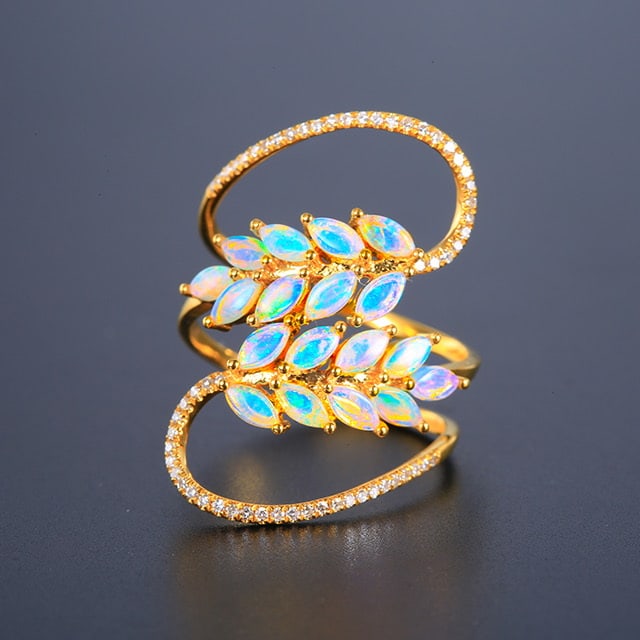 14k Gold 0.84 Ctw Natural Opal & Diamond Ring: Ref:231032355 // gold content:14k gold // ring size:7. 25us // // main gemstone:opal // shape:marquise // carat weight:0. 66ct // color:color // treatment:natural // // adjacent gemstone 2 : diamond