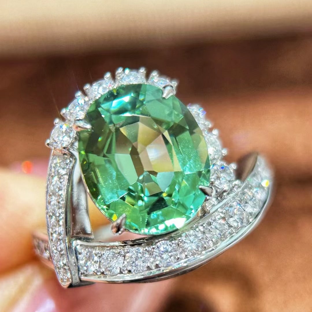 14k Gold 5.20 Ctw Natural Tourmaline & Diamond Ring: Ref:231032425 // gold content:14k gold // ring size:7. 25us // // main gemstone:tourmaline // shape:oval // carat weight:4. 34ct // color:green // treatment:natural // // adjacent gemstone 2 : diamond