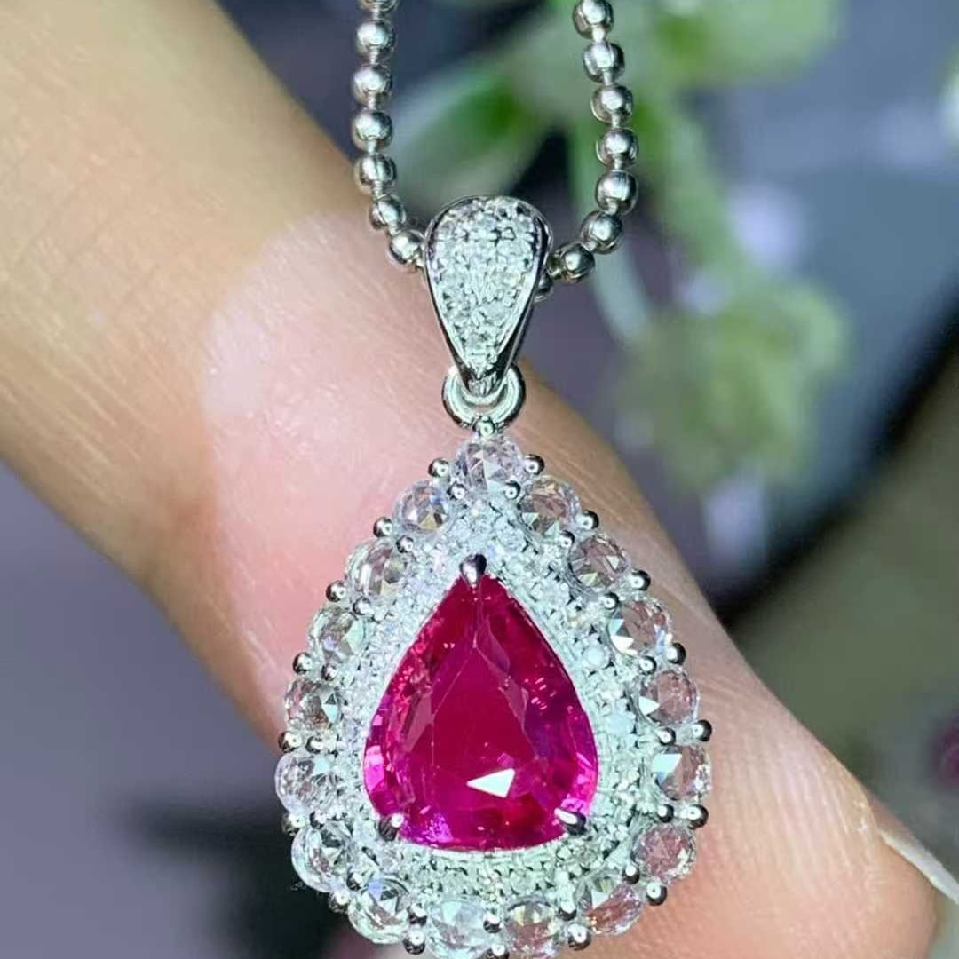 14k Gold 1.15 Ct Natural Ruby & Diamond & Sapphire Pendant( Without Chain ): Ref:231032439 // gold content:14k gold // main gemstone:ruby // shape:pear // carat weight:1. 15ct // color:red // treatment:natural // // adjacent gemstone 2 : diamond // shape:round // clarity