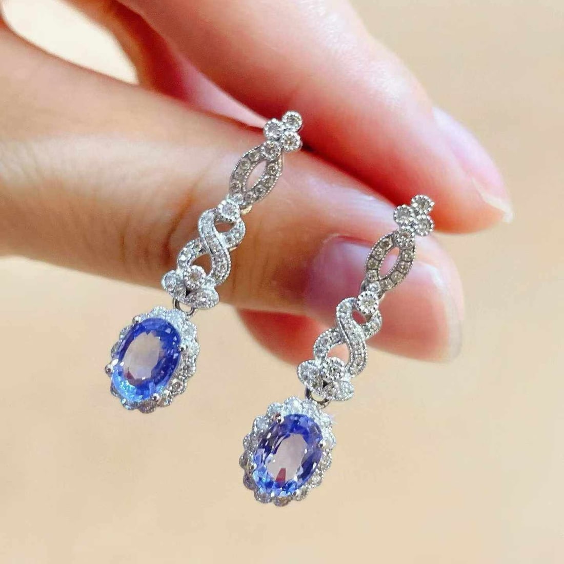 14k Gold 2.49 Ctw Natural Sapphire & Diamond Earrings: Ref:231033039 // gold content:14k gold // main gemstone:sapphire // shape:oval // carat weight:2. 09ct // color:blue // treatment:natural // // adjacent gemstone 2 : diamond // shape:round // carat