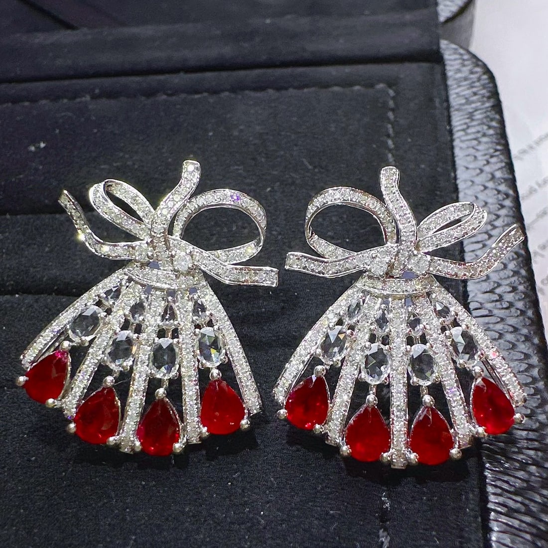 14k Gold 3.91 Ctw Natural Ruby & Diamond Earrings: Ref:231033046 // gold content:14k gold // main gemstone:ruby // shape:pear // carat weight:2. 85ct // color:red // treatment:natural // // adjacent gemstone 2 : diamond // shape:round // carat