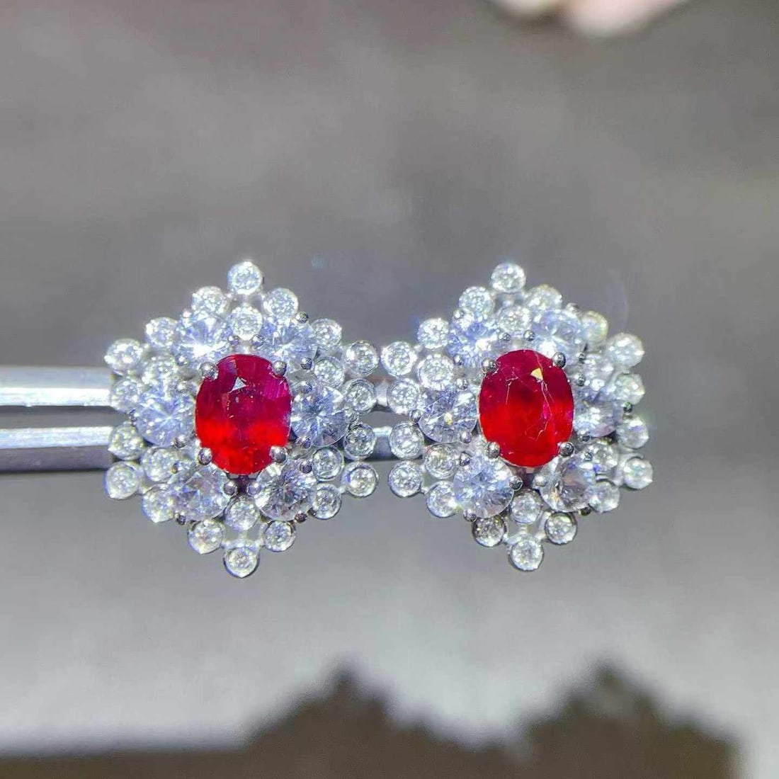 14k Gold 2.09 Ctw Natural Ruby & Sapphire Earrings: Ref:231033075 // gold content:14k gold // main gemstone:ruby // shape:oval // carat weight:1. 07ct // color:red // treatment:natural // // adjacent gemstone 2 : sapphire // shape:round // carat