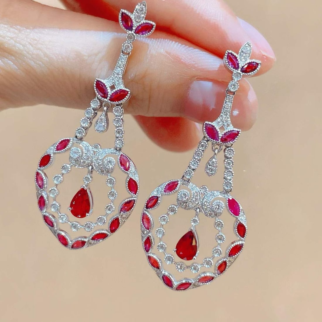 14k Gold 4.38 Ctw Natural Ruby & Diamond Earrings: Ref:231033109 // gold content:14k gold // main gemstone:ruby // shape:pear & marquise // carat weight:3. 58ct // color:red // treatment:natural // // adjacent gemstone 2 : diamond // shape:round // ca