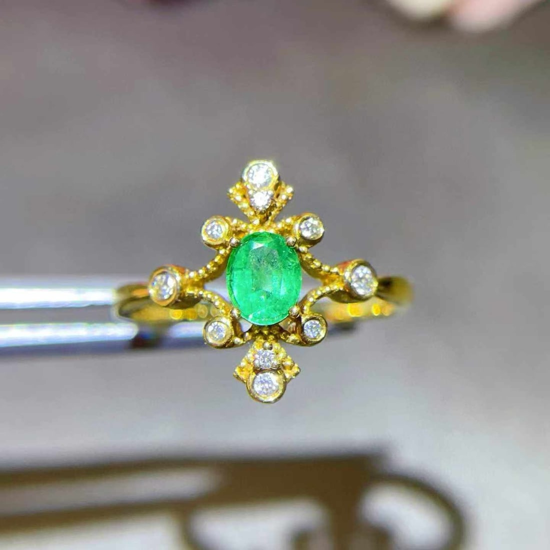 14k Gold 0.37 Ctw Natural Emerald & Diamond Ring: Ref:231033113 // gold content:14k gold // ring size:7. 25us // // main gemstone:emerald // shape:oval // carat weight:0. 29ct // color:green // treatment:natural // // adjacent gemstone 2 : diamond