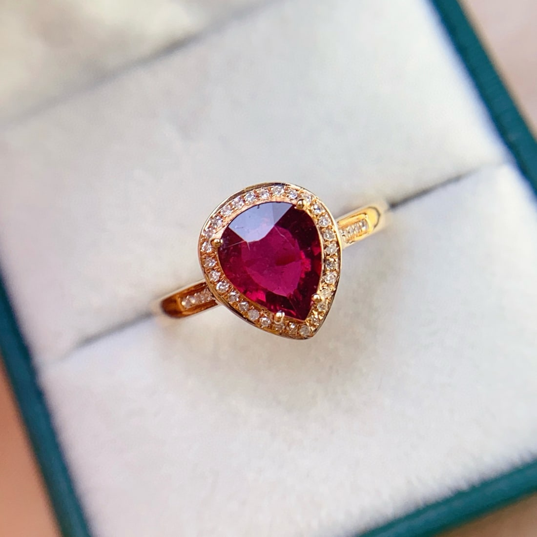 14k Gold 1.25 Ct Natural Tourmaline & Diamond Ring: Ref:231033123 // gold content:14k gold // ring size:7. 25us // // main gemstone:tourmaline // shape:pear // carat weight:1. 25ct // color:red // treatment:natural // // adjacent gemstone 2 : diamond