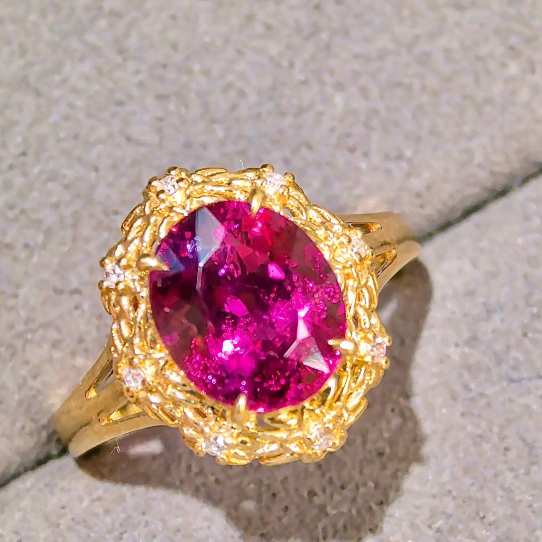 14k Gold 3.47 Ctw Natural Tourmaline & Diamond Ring: Ref:231033125 // gold content:14k gold // ring size:7. 25us // // main gemstone:tourmaline // shape:oval // carat weight:3. 41ct // color:purplish red // treatment:natural // // adjacent gemstone 2 :