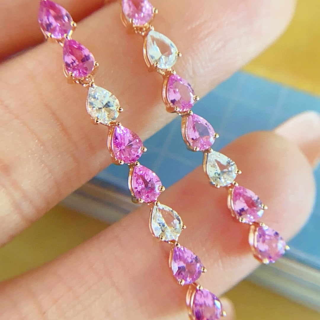 14k Gold 2.7 Ct Natural Sapphire Earrings: Ref:231033152 // gold content:14k gold // main gemstone:sapphire // shape:pear // carat weight:2. 7ct // color:pink & white // treatment:natural // Condition: New Low Estimate: 4400.00 High Estimate: