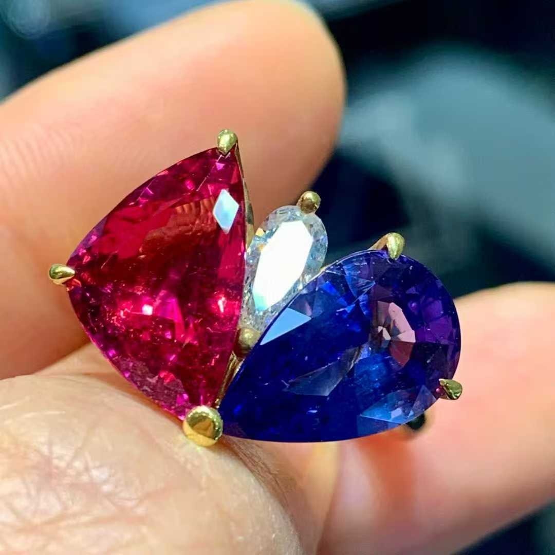 14k Gold 7.14 Ctw Natural Tanzanite & Tourmaline Ring: Ref:231033173 // gold content:14k gold // ring size:7. 25us // // main gemstone 1:tanzanite // shape:pear // carat weight:3. 67ct // color:blue // treatment:natural // // main gemstone 2: tourmaline