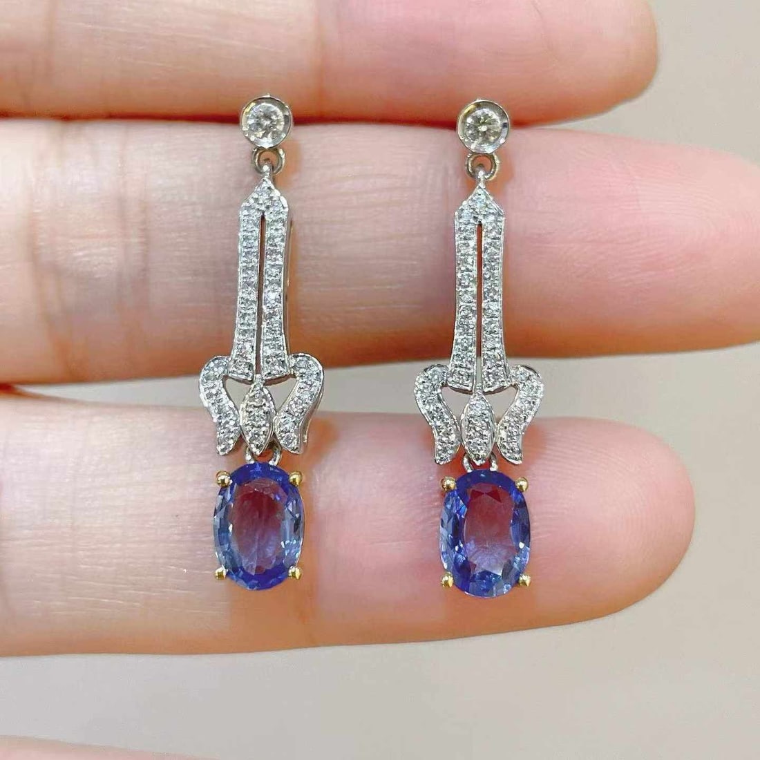 14k Gold 2.18 Ctw Natural Sapphire & Diamond Earrings: Ref:231033182 // gold content:14k gold // main gemstone:sapphire // shape:oval // carat weight:1. 89ct // color:blue // treatment:natural // // adjacent gemstone 2 : diamond // shape:round // carat