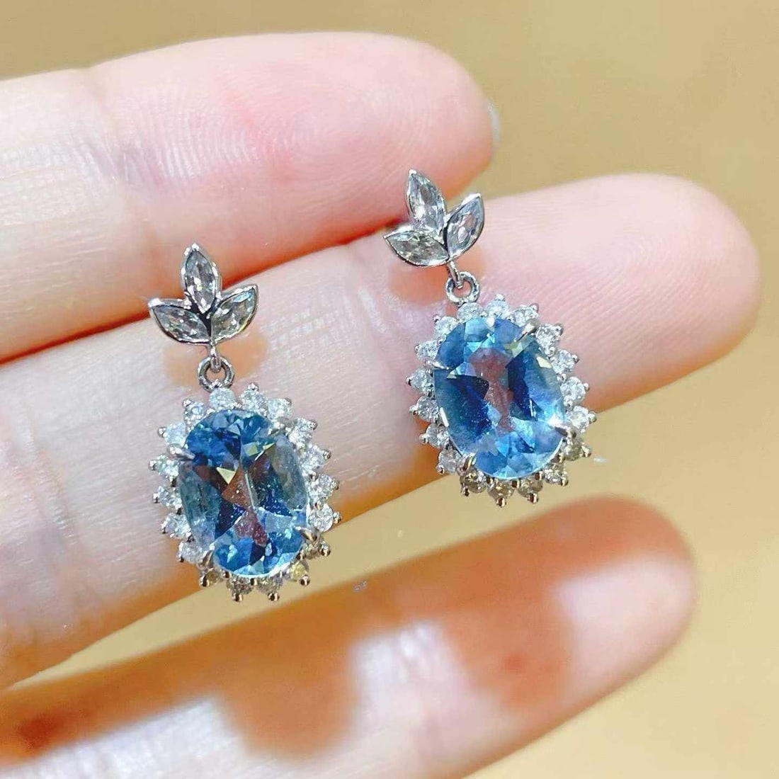 14k Gold 2.70 Ctw Natural Aquamarine & Diamond Earrings: Ref:231033189 // gold content:14k gold // main gemstone:aquamarine // shape:oval // carat weight:2. 04ct // color:blue // treatment:natural // // adjacent gemstone 2 : diamond // shape:multiply // car