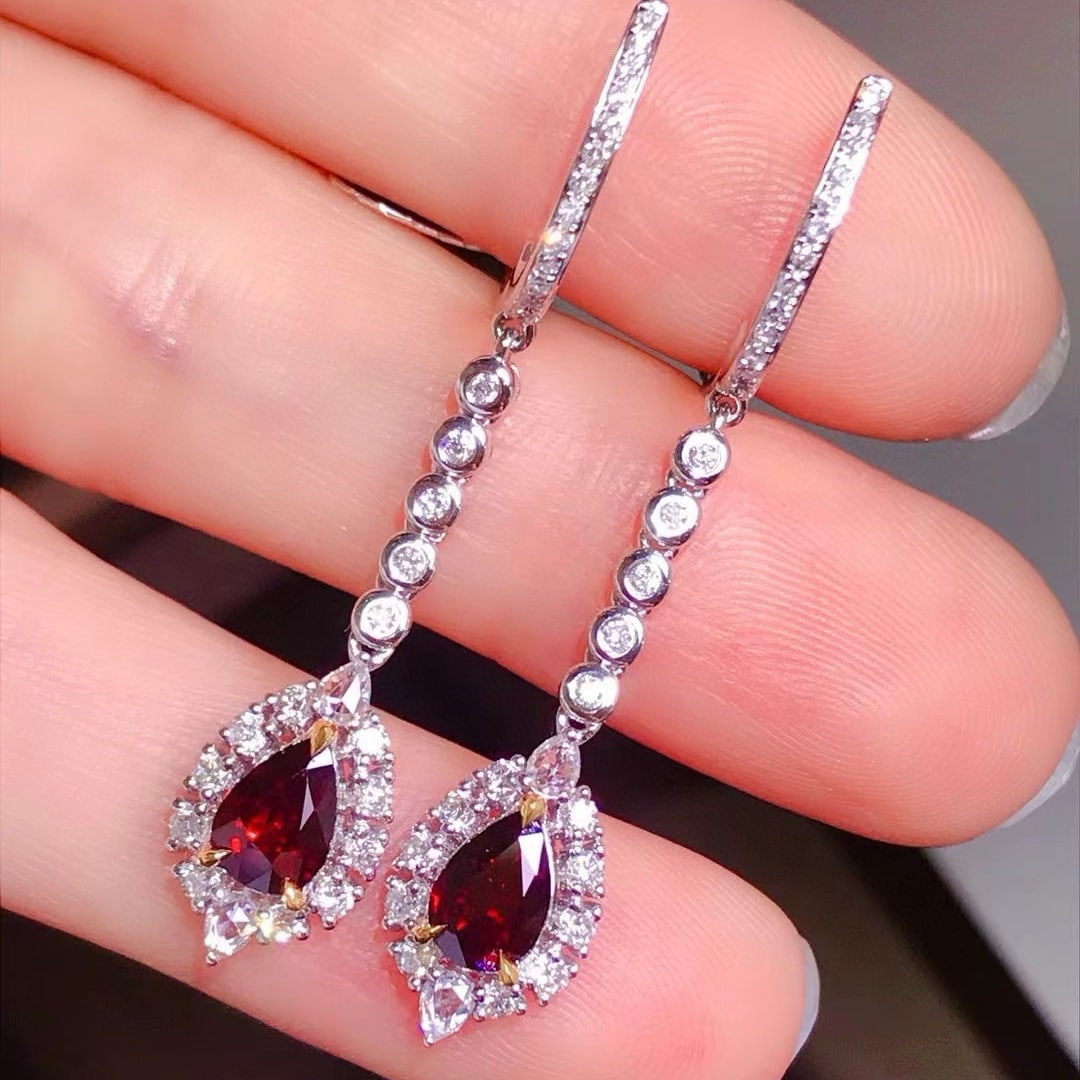 14k Gold 2.19 Ctw Natural Ruby & Diamond Earrings: Ref:231033214 // gold content:14k gold // main gemstone:ruby // shape:pear // carat weight:1. 4ct // color:red // treatment:natural // // adjacent gemstone 2 : diamond // shape:multiply // carat