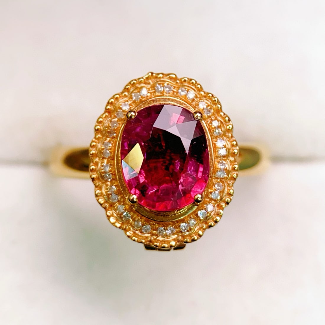 14k Gold 1.91 Ctw Natural Tourmaline & Diamond Ring: Ref:231033257 // gold content:14k gold // ring size:7. 25us // // main gemstone:tourmaline // shape:oval // carat weight:1. 8ct // color:red // treatment:natural // // adjacent gemstone 2 : diamond