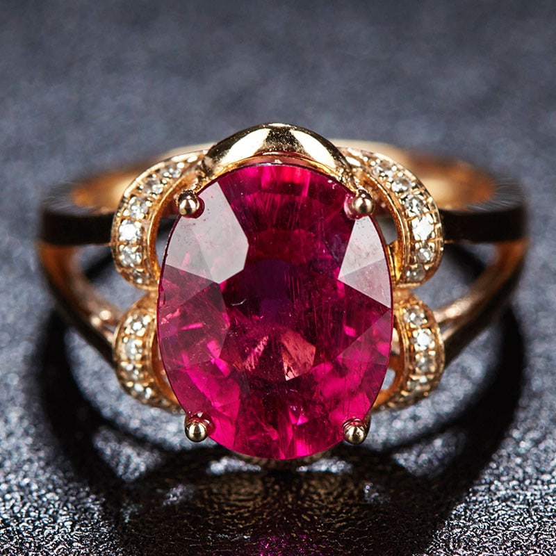 14k Gold 3.9 Ct Natural Tourmaline & Diamond Ring: Ref:231034001 // gold content:14k gold // ring size:7. 25us // // main gemstone:tourmaline // shape:oval // carat weight:3. 9ct // color:red // treatment:natural // // adjacent gemstone 2 : diamond