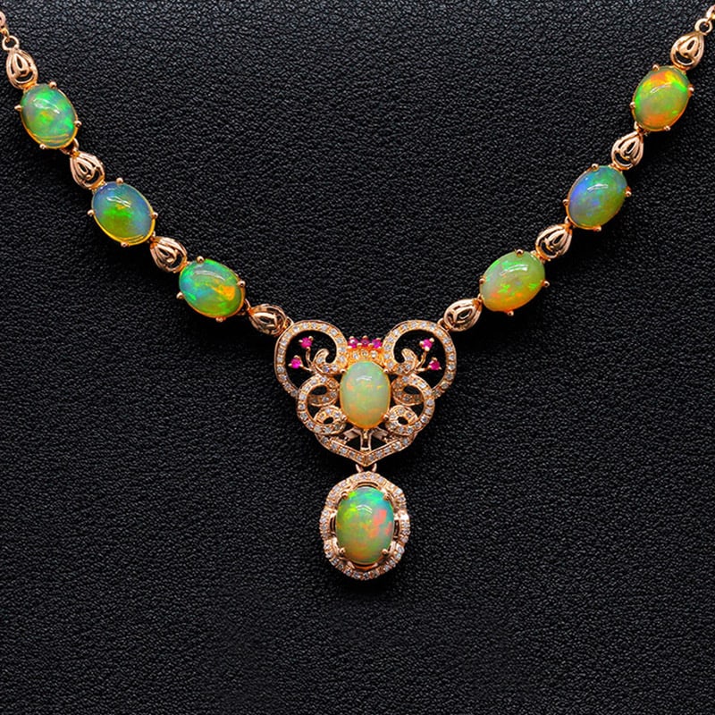 14k Gold 9.12 Ctw Natural Opal & Diamond Necklace: Ref:231034021 // gold content:14k gold // main gemstone:opal // shape:oval // carat weight:8. 75ct // color:color // treatment:natural // // adjacent gemstone 2 : diamond // shape:round // carat