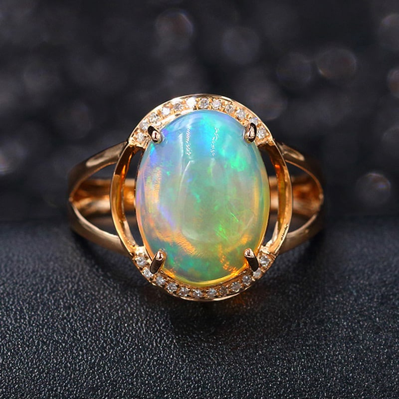 14k Gold 4.47 Ctw Natural Opal & Diamond Ring: Ref:231034022 // gold content:14k gold // ring size:7. 25us // // main gemstone:opal // shape:oval // carat weight:4. 4ct // color:color // treatment:natural // // adjacent gemstone 2 : diamond //