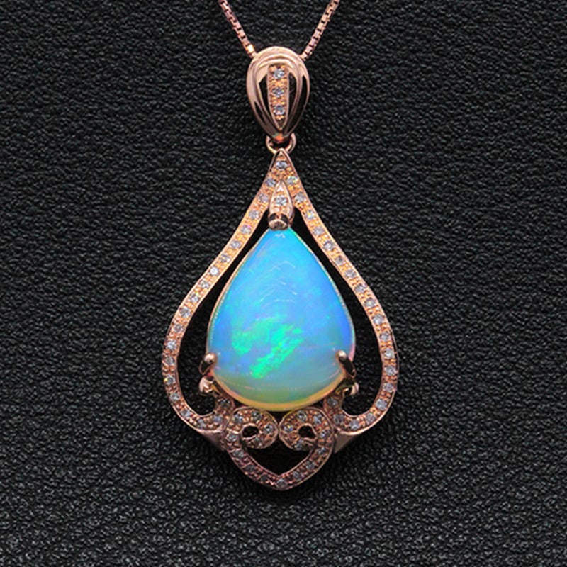 14k Gold 5.13 Ctw Natural Opal & Diamond Pendant( Without Chain ): Ref:231034023 // gold content:14k gold // main gemstone:opal // shape:pear // carat weight:4. 95ct // color:color // treatment:natural // // adjacent gemstone 2 : diamond // shape:round // carat