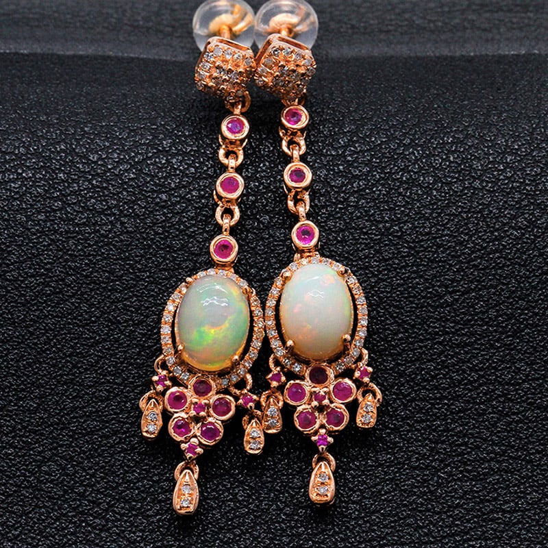 14k Gold 2.1 Ct Natural Opal & Diamond & Ruby Earrings: Ref:231034027 // gold content:14k gold // main gemstone:opal // shape:oval // carat weight:2. 1ct // color:color // treatment:natural // // adjacent gemstone 2 : diamond // shape:round // clarity grad