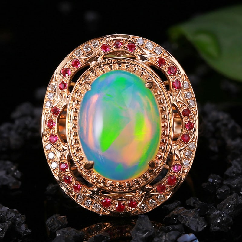 14k Gold 4.36 Ctw Natural Opal & Diamond Ring: Ref:231034028 // gold content:14k gold // ring size:7. 25us // // main gemstone:opal // shape:oval // carat weight:4. 24ct // color:color // treatment:natural // // adjacent gemstone 2 : diamond //