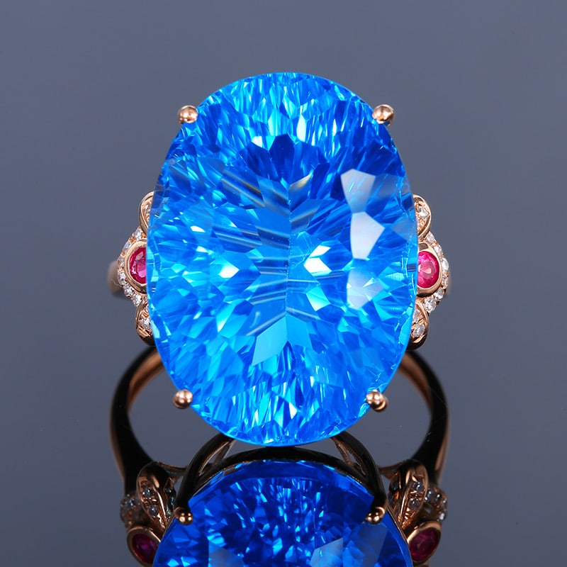 14k Gold 26.81 Ct Natural Topaz & Diamond & Ruby Ring: Ref:231034042 // gold content:14k gold // ring size:7. 25us // // main gemstone:topaz // shape:oval // carat weight:26. 81ct // color:blue // treatment:natural // // adjacent gemstone 2 : diamond // s