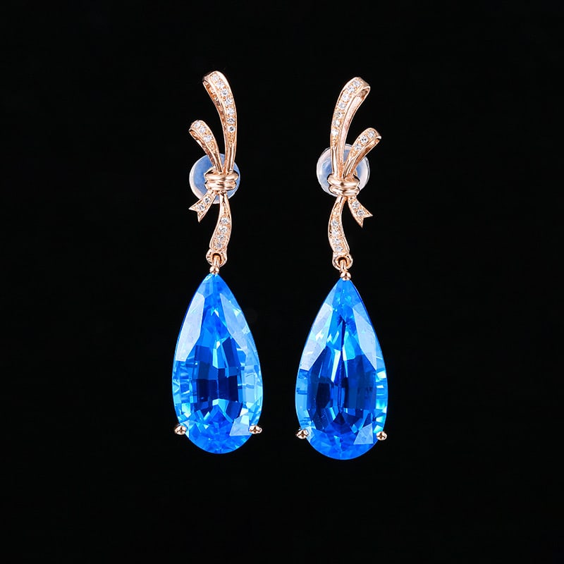 14k Gold 16.08 Ct Natural Topaz & Diamond Earrings: Ref:231034044 // gold content:14k gold // main gemstone:topaz // shape:pear // carat weight:16. 08ct // color:blue // treatment:natural // // adjacent gemstone 2 : diamond // shape:round // clarity