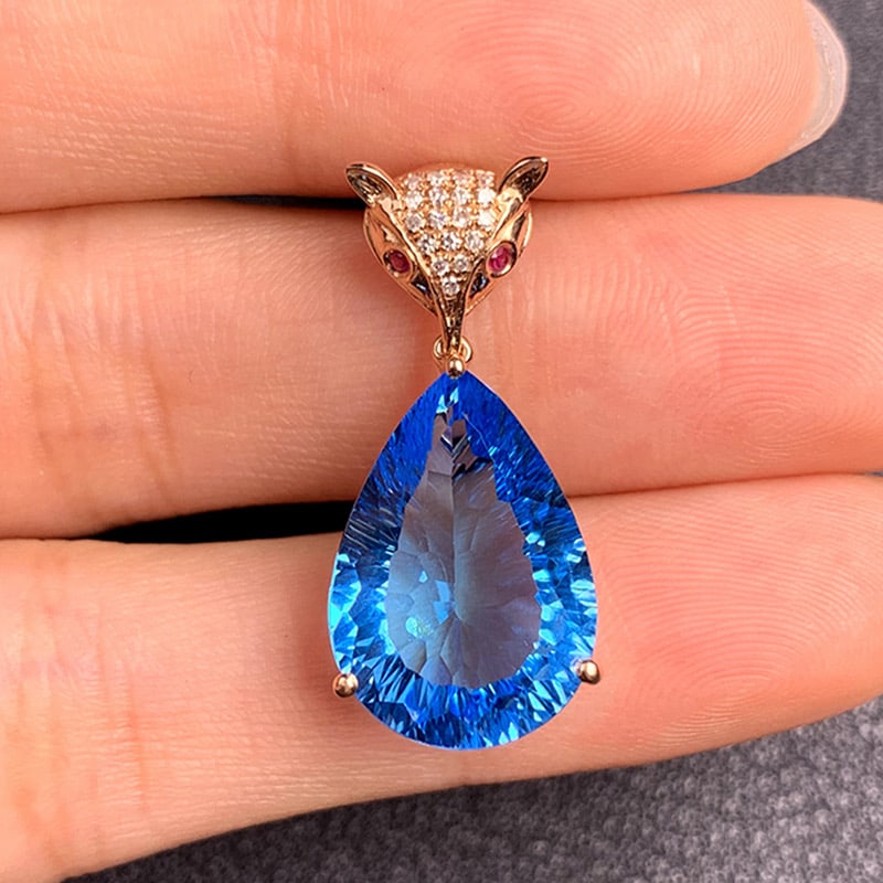 14k Gold 8.82 Ct Natural Topaz & Diamond & Ruby Pendant( Without Chain ): Ref:231034045 // gold content:14k gold // main gemstone:topaz // shape:pear // carat weight:8. 82ct // color:blue // treatment:natural // // adjacent gemstone 2 : diamond // shape:round // clarity gra