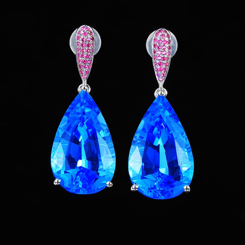14k Gold 18.16 Ct Natural Topaz & Ruby Earrings: Ref:231034099 // gold content:14k gold // main gemstone:topaz // shape:pear // carat weight:18. 16ct // color:blue // treatment:natural // // adjacent gemstone 2 : ruby // shape:round // color:red // 
