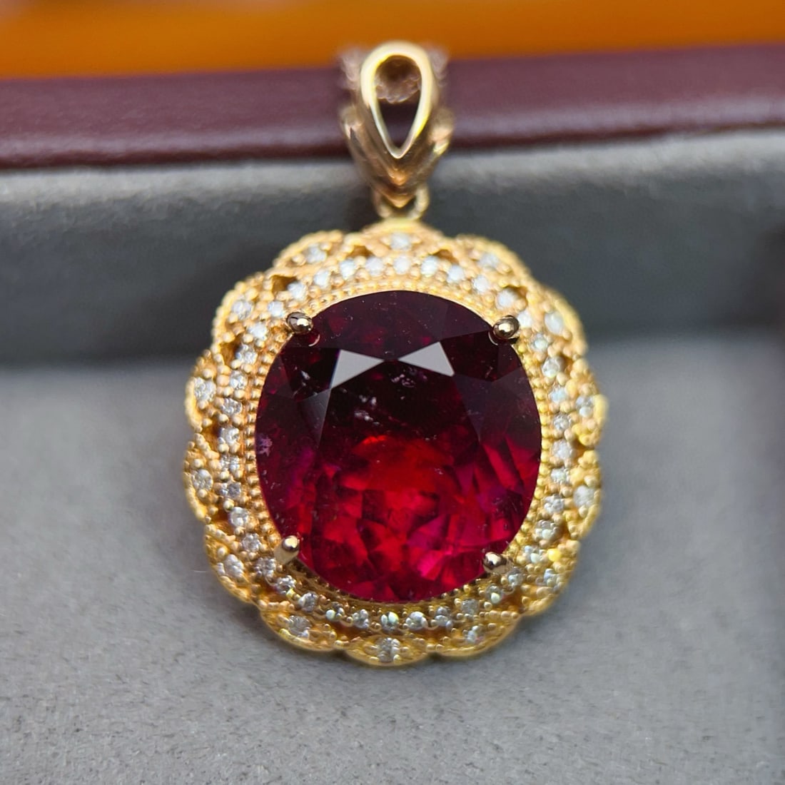 14k Gold 10.5 Ct Natural Tourmaline & Diamond Pendant( Without Chain ): Ref:231034103 // gold content:14k gold // main gemstone:tourmaline // shape:oval // carat weight:10. 5ct // color:red // treatment:natural // // adjacent gemstone 2 : diamond // number of stones:54 //