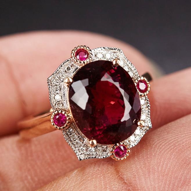 14k Gold 5.1 Ct Natural Tourmaline & Diamond & Ruby Ring: Ref:231034143 // gold content:14k gold // ring size:7. 25us // // main gemstone:tourmaline // shape:oval // carat weight:5. 1ct // color:red // treatment:natural // // adjacent gemstone 2 : diamond //
