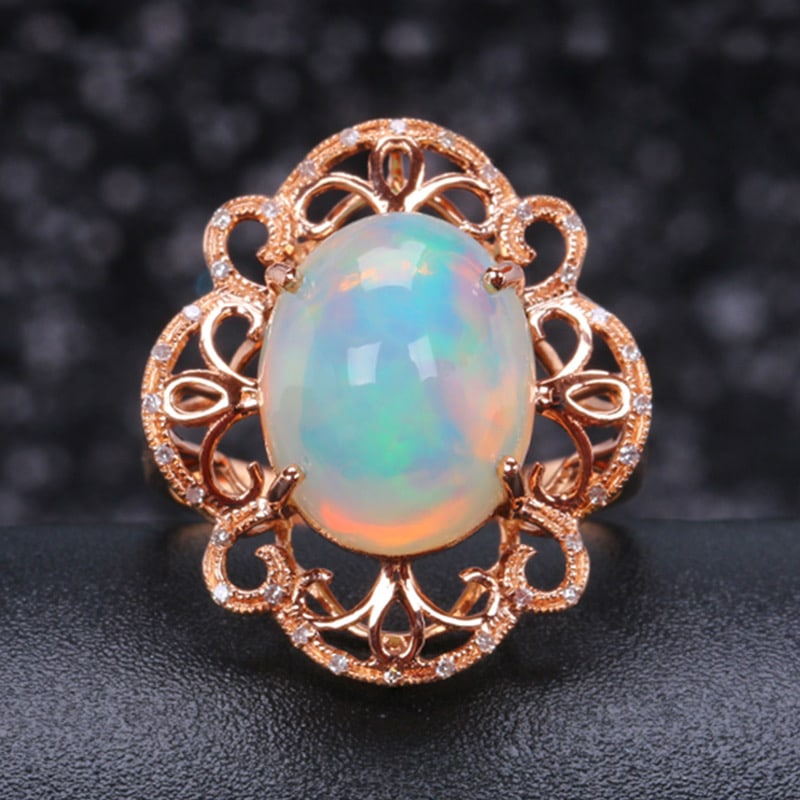 14k Gold 4.85 Ctw Natural Opal & Diamond Ring: Ref:231034176 // gold content:14k gold // ring size:7. 25us // // main gemstone:opal // shape:oval // carat weight:4. 75ct // color:color // treatment:natural // // adjacent gemstone 2 : diamond //