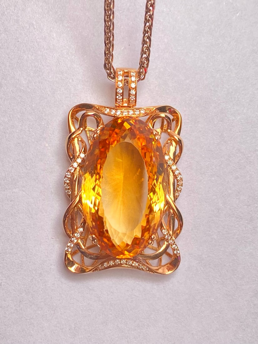 14k Gold 20.85 Ct Natural Citrine & Diamond Pendant( Without Chain ): Ref:231034191 // gold content:14k gold // main gemstone:citrine // shape:oval // carat weight:20. 85ct // color:yellow // treatment:natural // // adjacent gemstone 2 : diamond // number of stones:42