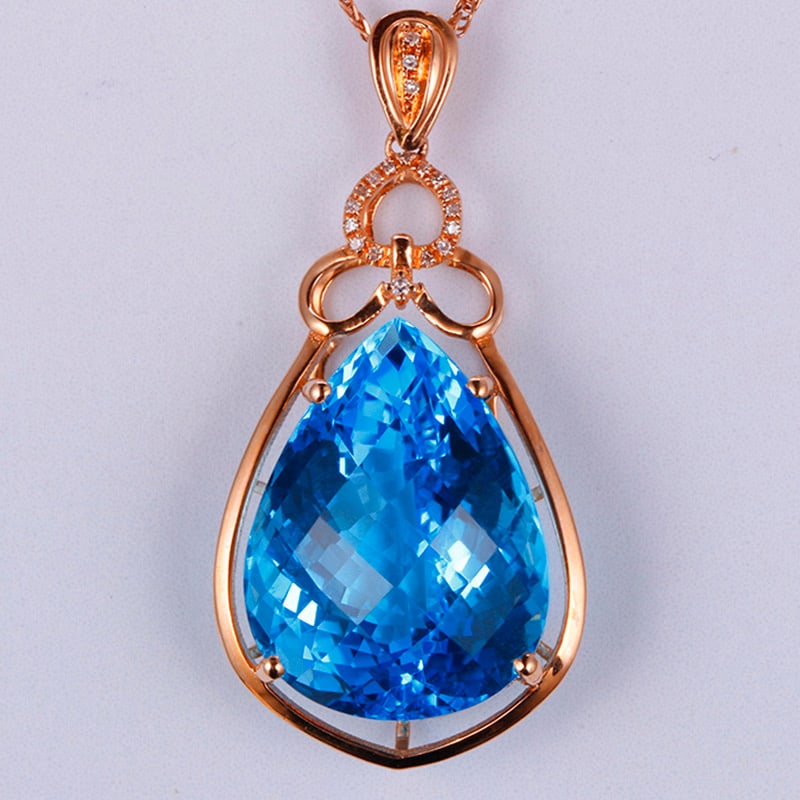 14k Gold 24.30 Ctw Natural Topaz & Diamond Pendant( Without Chain ): Ref:231034213 // gold content:14k gold // main gemstone:topaz // shape:pear // carat weight:24. 24ct // color:blue // treatment:natural // // adjacent gemstone 2 : diamond // shape:round // carat