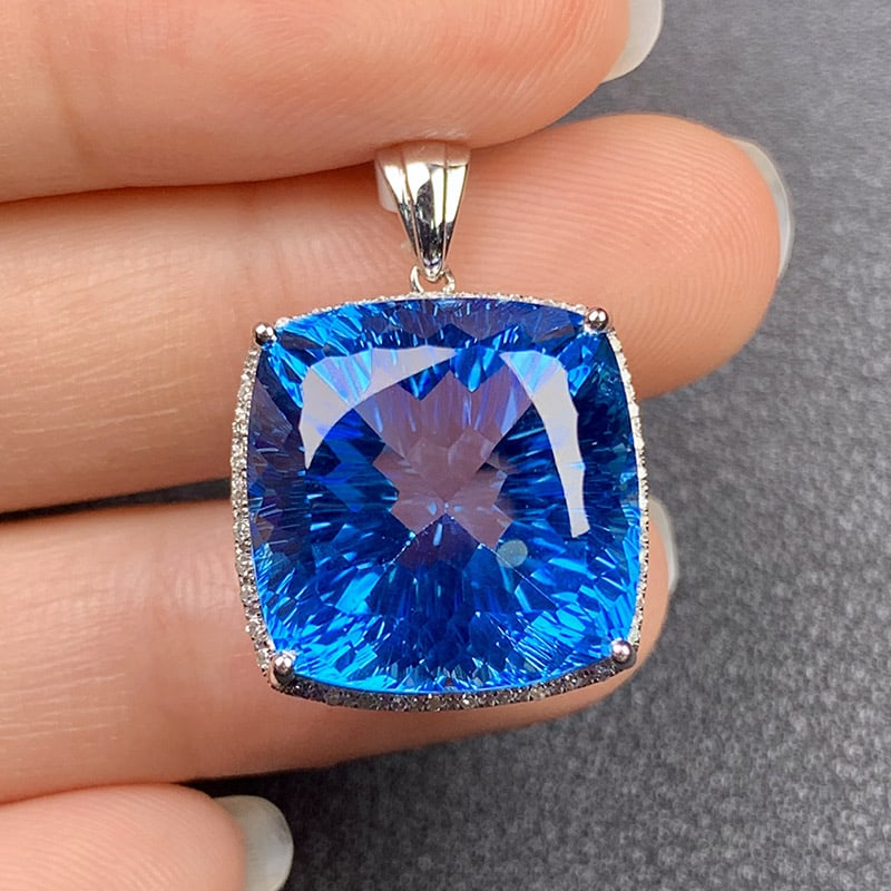 14k Gold 29.19 Ct Natural Topaz & Diamond Pendant( Without Chain ): Ref:231034214 // gold content:14k gold // main gemstone:topaz // shape:cushion // carat weight:29. 19ct // color:blue // treatment:natural // // adjacent gemstone 2 : diamond // shape:round //