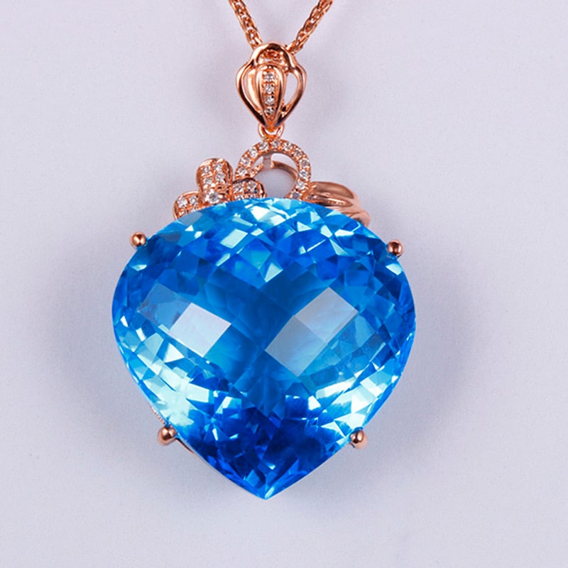 14k Gold 37.14 Ctw Natural Topaz & Diamond Pendant( Without Chain ): Ref:231034216 // gold content:14k gold // main gemstone:topaz // shape:pear // carat weight:37. 05ct // color:blue // treatment:natural // // adjacent gemstone 2 : diamond // shape:round // carat