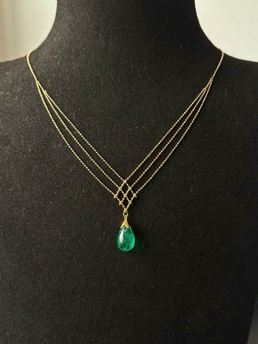 14k Gold 5.06 Ct Natural Emerald Necklace: Ref:231034226 // gold content:14k gold // main gemstone:emerald // shape:pear // carat weight:5. 06ct // color:green // treatment:natural // Condition: New Low Estimate: 19000.00 High Estimate: 28000.