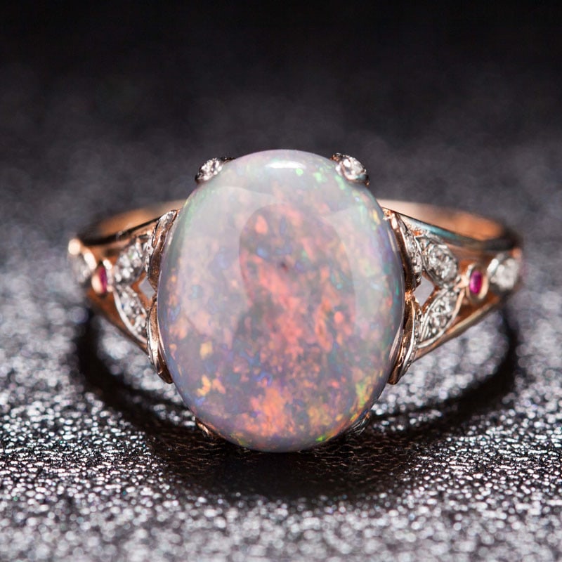 14k Gold 3.9 Ct Natural Opal & Diamond & Ruby Ring: Ref:231034244 // gold content:14k gold // ring size:7. 25us // // main gemstone:opal // shape:oval // carat weight:3. 9ct // color:color // treatment:natural // // adjacent gemstone 2 : diamond //
