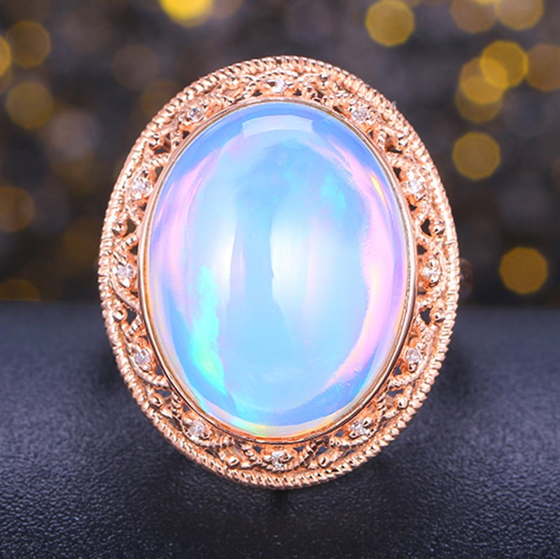 14k Gold 10.05 Ctw Natural Opal & Diamond Ring: Ref:231034245 // gold content:14k gold // ring size:7. 25us // // main gemstone:opal // shape:oval // carat weight:9. 99ct // color:color // treatment:natural // // adjacent gemstone 2 : diamond //