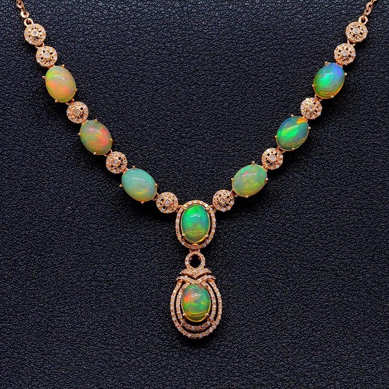14k Gold 6.99 Ctw Natural Opal & Diamond Necklace: Ref:231034246 // gold content:14k gold // main gemstone:opal // shape:oval // carat weight:6. 37ct // color:color // treatment:natural // // adjacent gemstone 2 : diamond // shape:round // carat