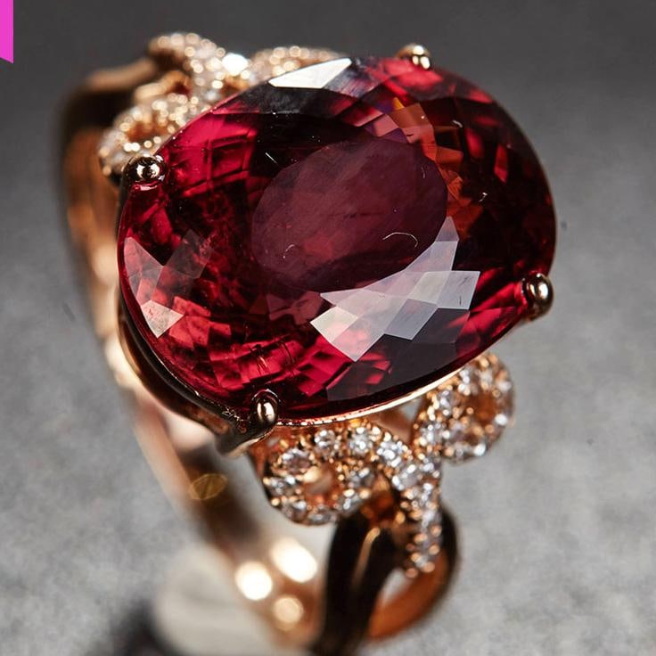 14k Gold 7.1 Ct Natural Tourmaline & Diamond Ring: Ref:231034251 // gold content:14k gold // ring size:7. 25us // // main gemstone:tourmaline // shape:oval // carat weight:7. 1ct // color:red // treatment:natural // // adjacent gemstone 2 : diamond