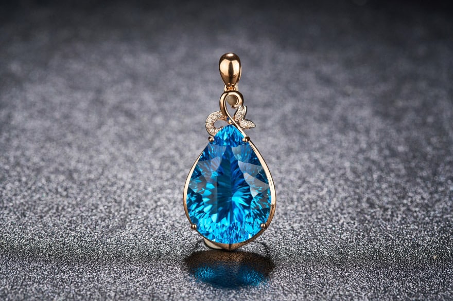 14k Gold 23.79 Ct Natural Topaz & Diamond Pendant( Without Chain ): Ref:231034258 // gold content:14k gold // main gemstone:topaz // shape:pear // carat weight:23. 79ct // color:blue // treatment:natural // // adjacent gemstone 2 : diamond // shape:round // clarity