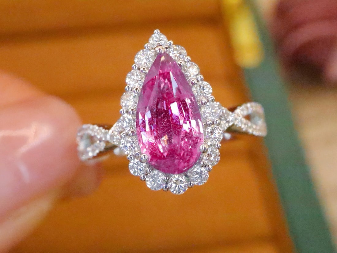 14k Gold 1.98 Ctw Natural Padparadscha Sapphire & Diamond Ring: Ref:231034280 // gold content:14k gold // ring size:7. 25us // // main gemstone:padparadscha sapphire // shape:pear // carat weight:1. 55ct // color:orangish pink // treatment:natural // // adjacent g